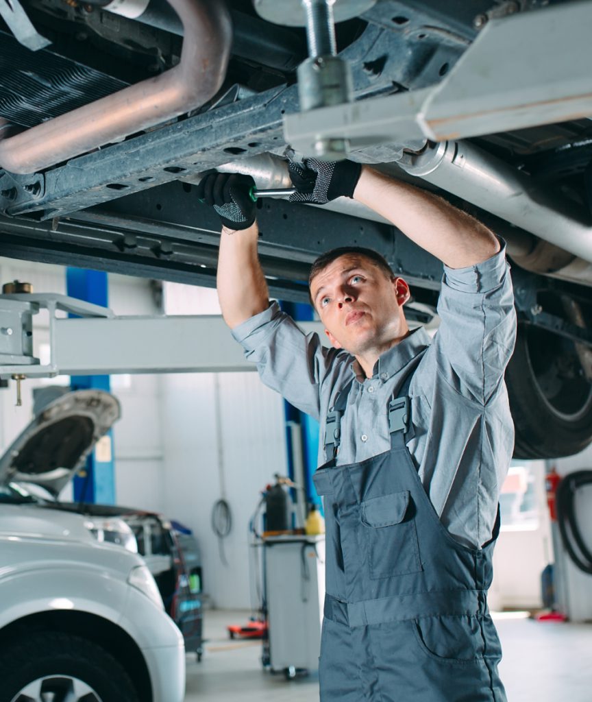Mechanic underneath a vehicle for auto repairs - Car Servicing Fareham | Gosport & Fareham Mechanics | Hampshire Garage