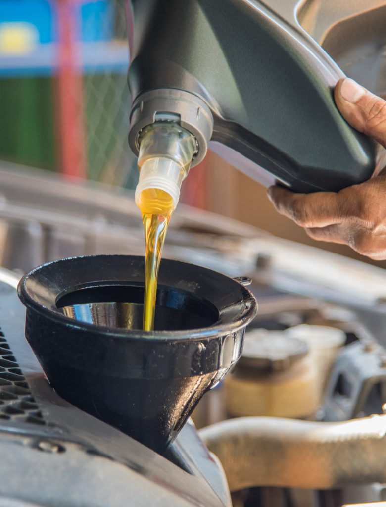 Mechanic pouring engine oil into a vehicle - Car Servicing Fareham | Gosport & Fareham Mechanics | Hampshire Garage
